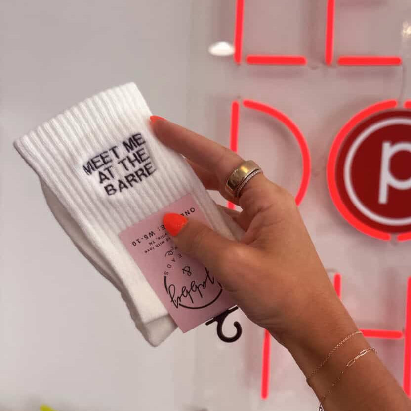 Pilates grip sock featuring an embroidered espresso martini logo, combining style and functionality for your workout.