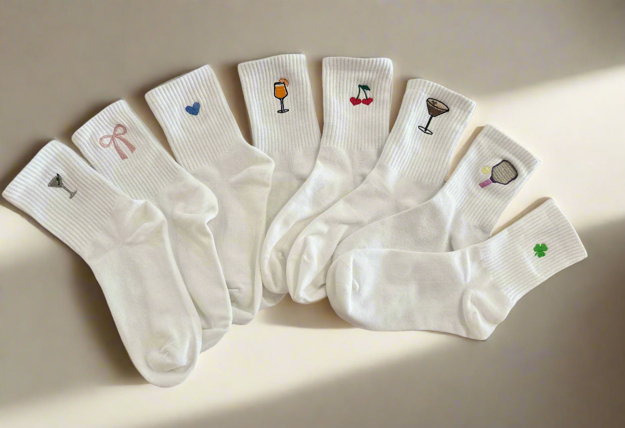 Embroidered designs on white crew socks: martini Glass, Bow, Heart, aperol spritz, cherry, espresso martini, pickleball paddle, shamrock