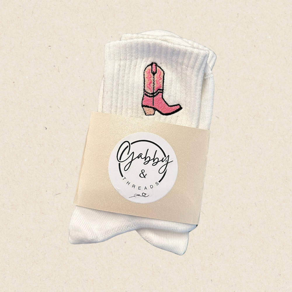 white grip socks with embroidered pink cowgirl boot