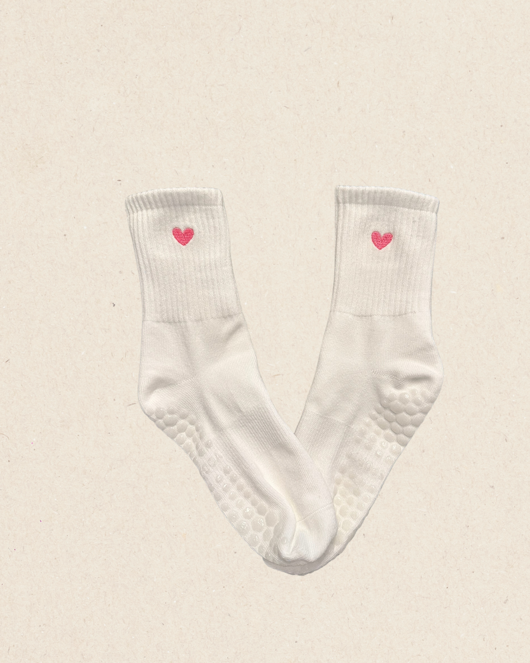 White grip socks for pilates with pink embroidered heart 