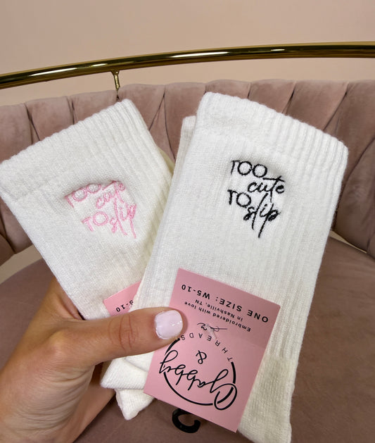 Embroidered Grip Socks that say "Too Cute to Slip"