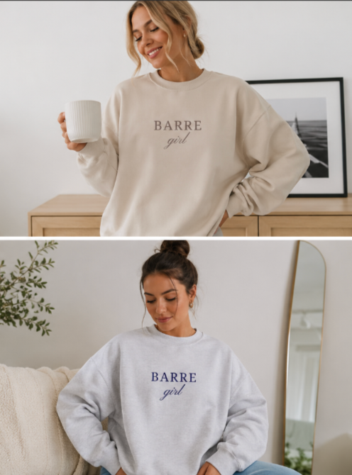 Two women wearing 'BARRE girl' sweatshirts in a home setting.