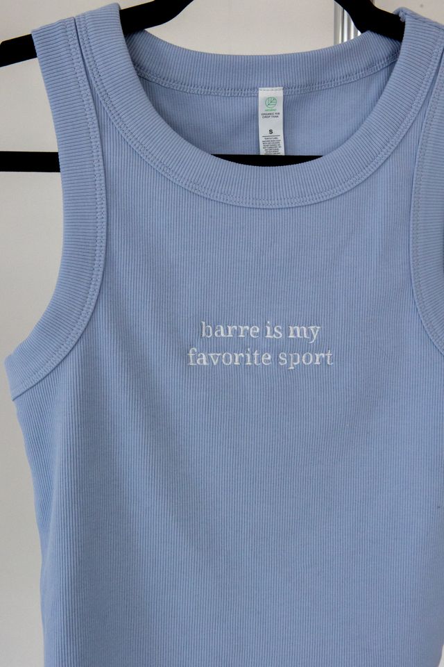 a light blue tank top with the words "barre is my favorite sport" embroidered on them