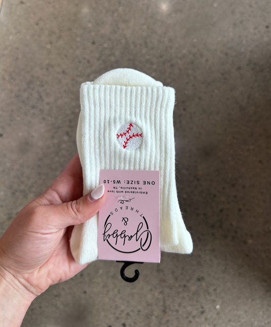 white crew sock with an embroidered baseball on it