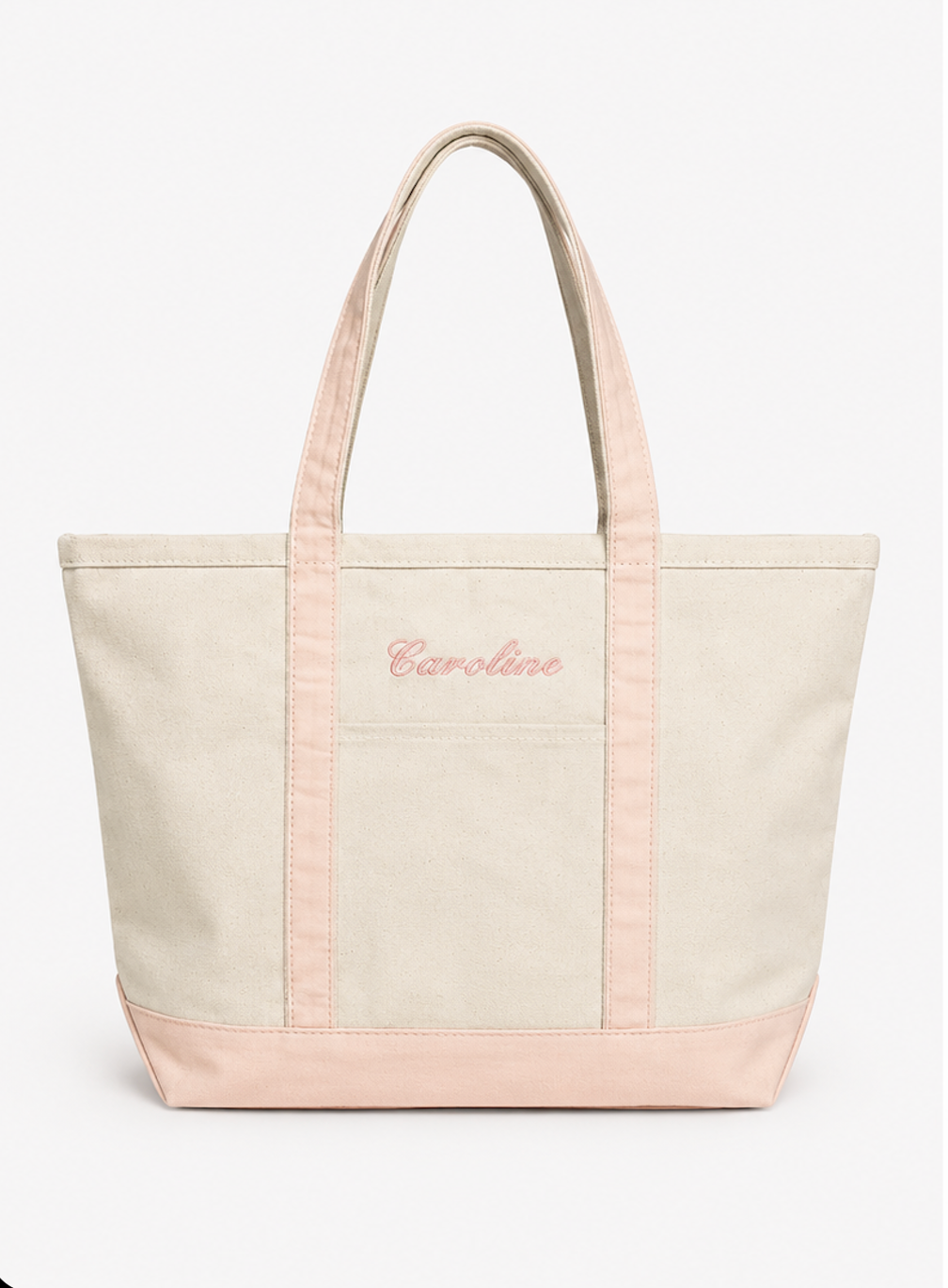 canvas tote bag with pink accents and 'Caroline' embroidery on a white background