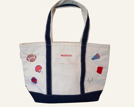White tote bag with embroidered gameday designs