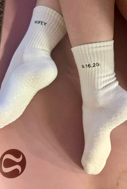 White grip socks with wifey on one and wedding date on the other