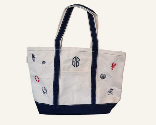 White beach themed canvas tote bag with embroidered designs and monogram