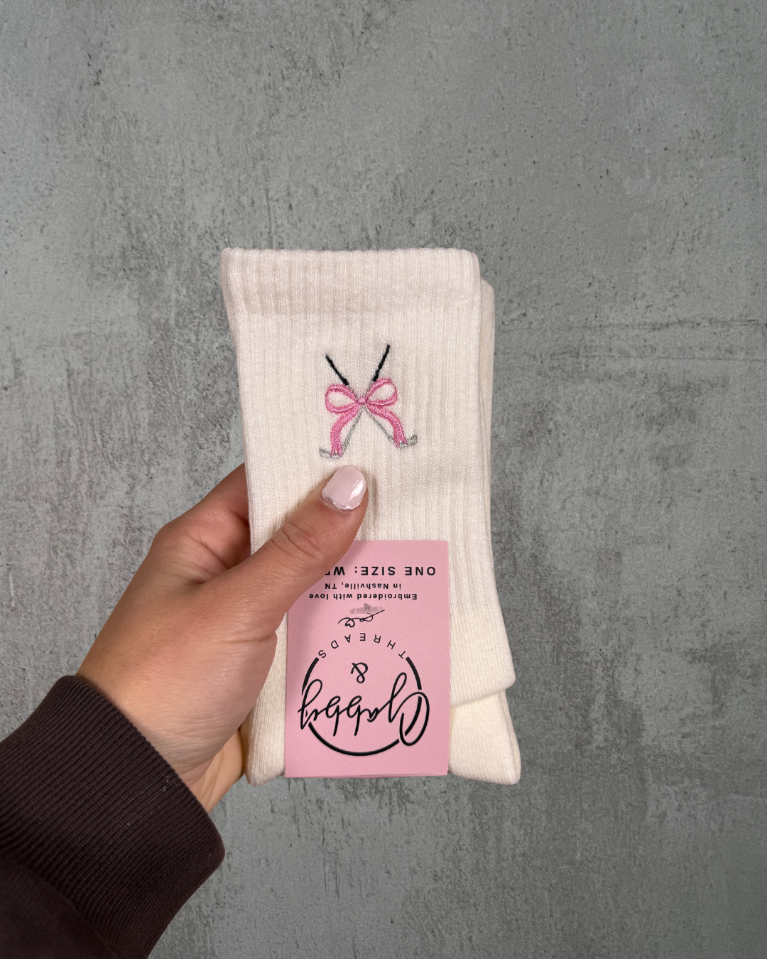 White socks with embroidered golf clubs with a blue coquette bow