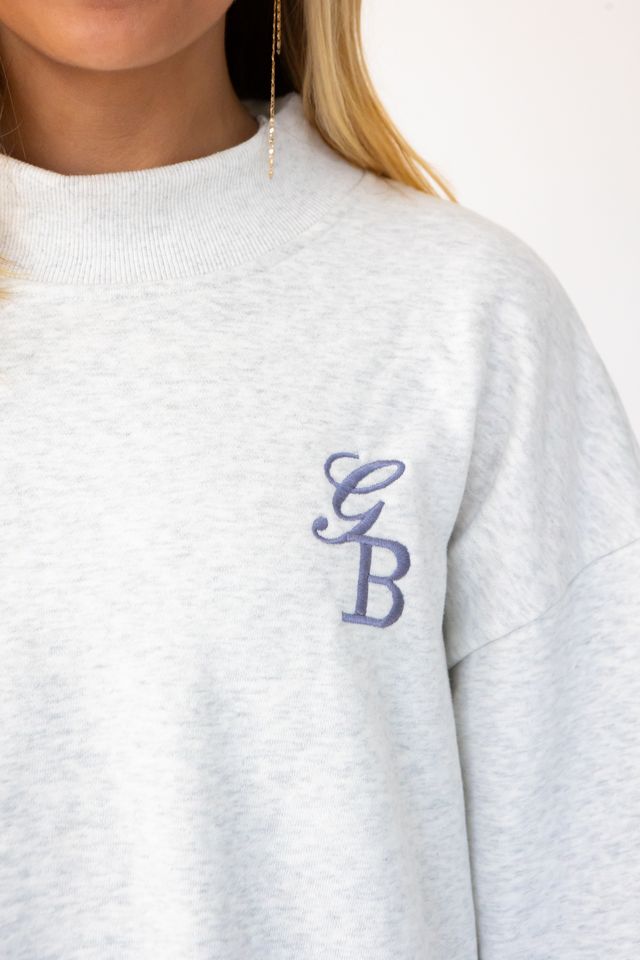 zoom in shot of the "GB" on the custom initials mock neck