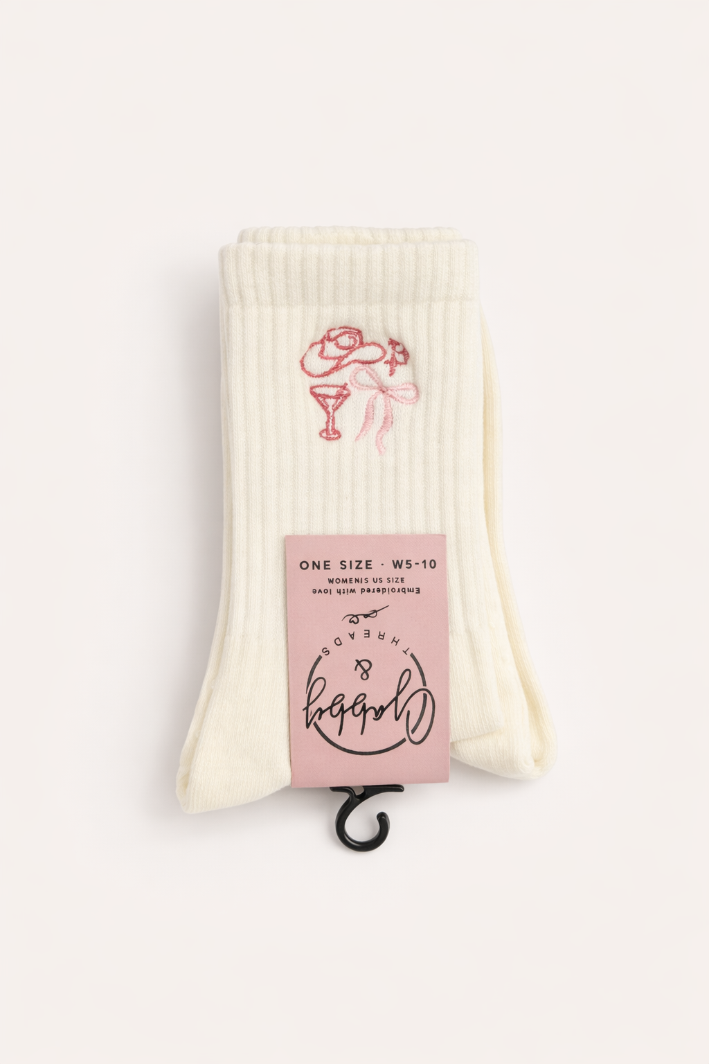 a pair of white grip socks with embroidered hat, coquette, bow and martini glass