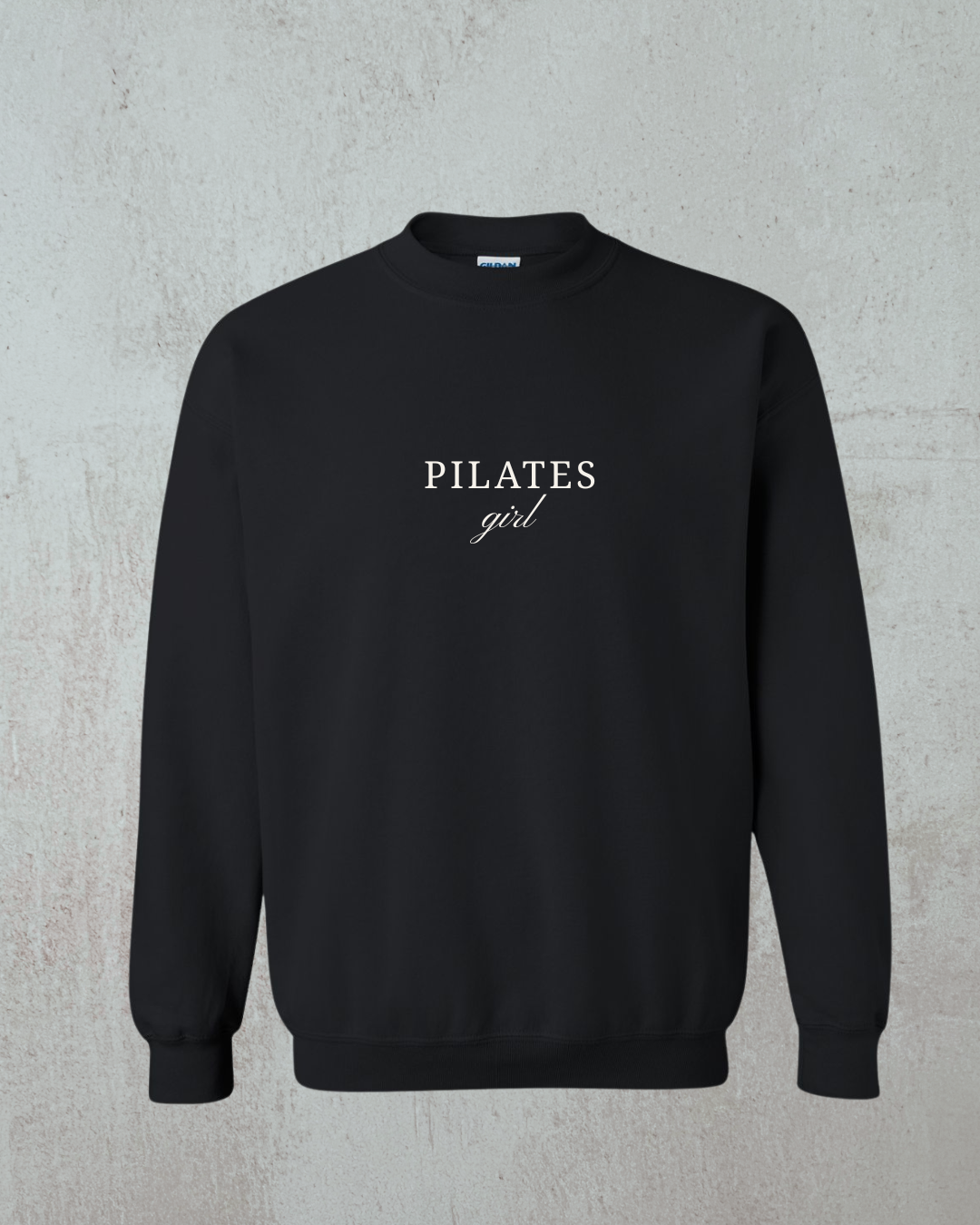 Black sweatshirt with 'PILATES girl' text on a gray background