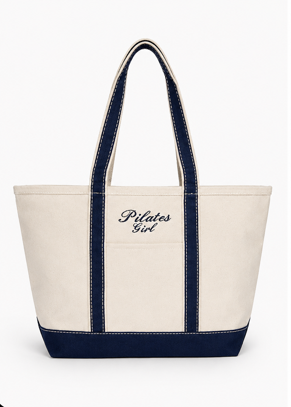 canvas tote bag with navy trim with the words "pilates girl" embroidered on it in navy thread