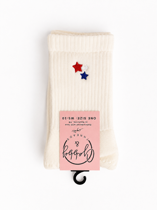 white socks with red white and blue stars embroidered on them