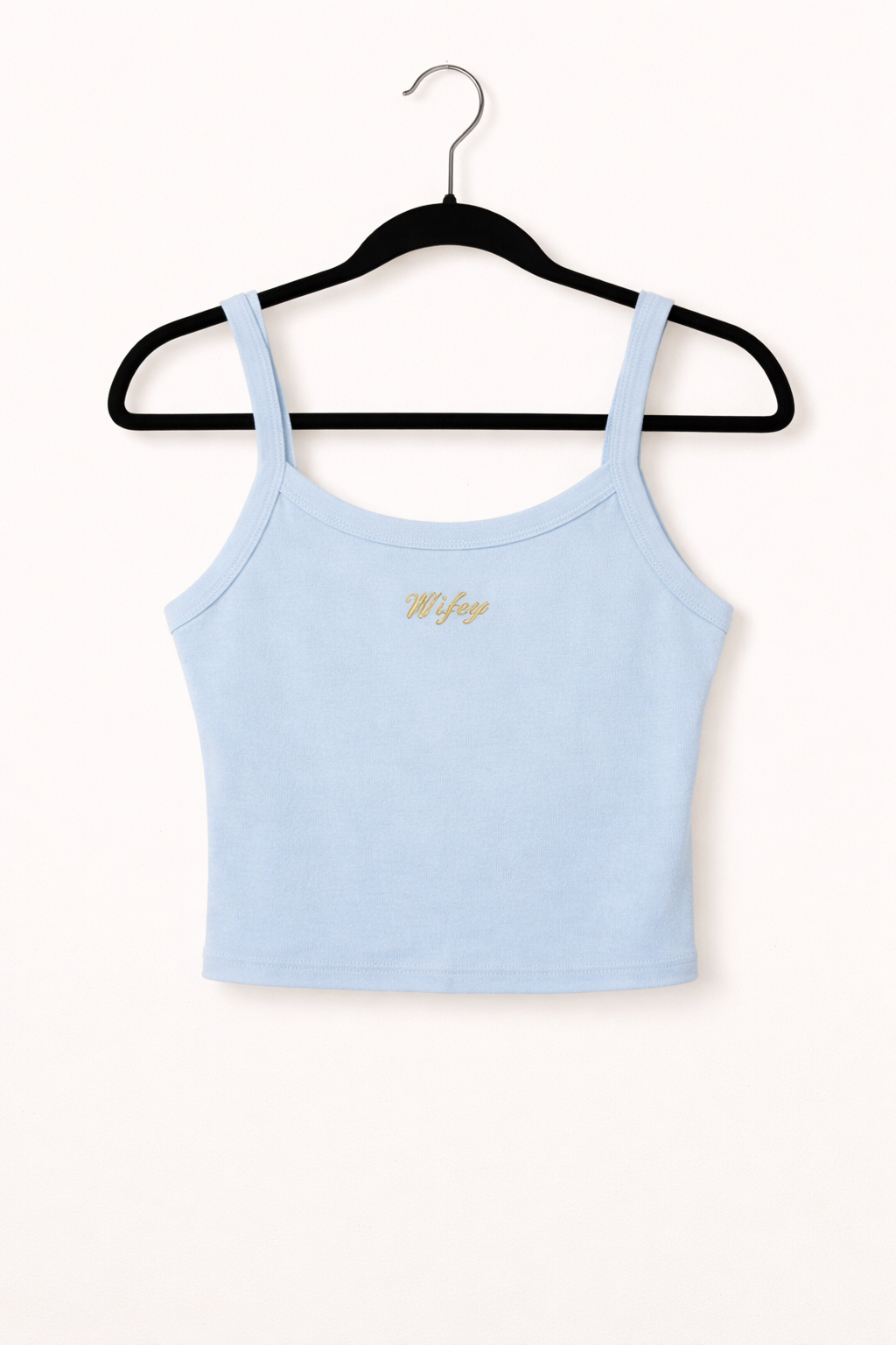 Light blue tank top with a brand logo on a black hanger against a white background